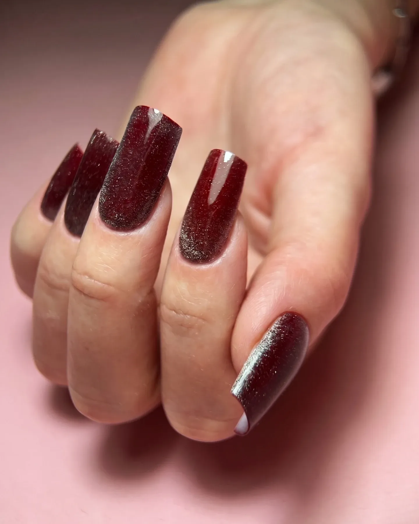 Short pink and orange nails with purple splashes and gold foil