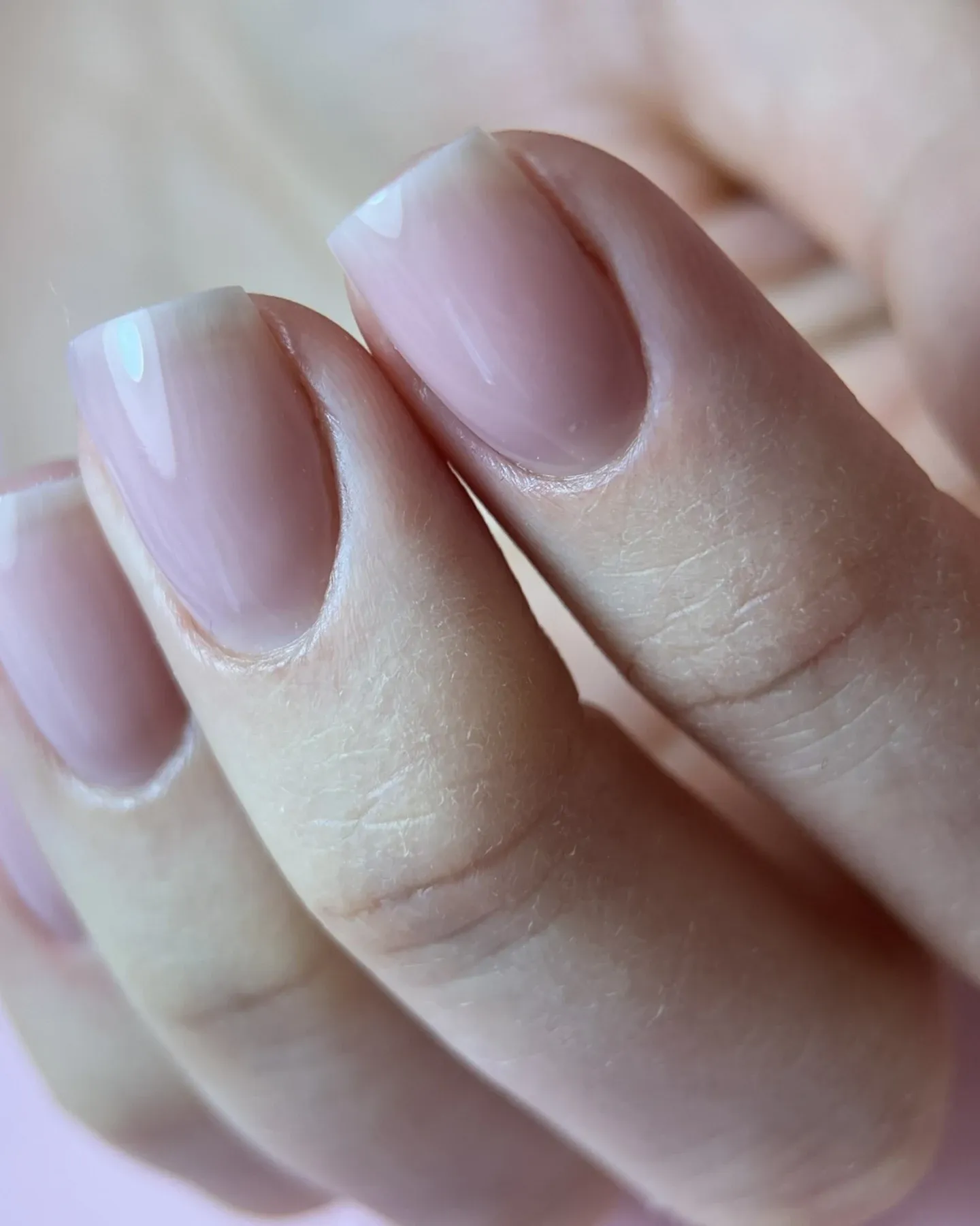 Long coffin-shaped burgundy nails with fine shimmer
